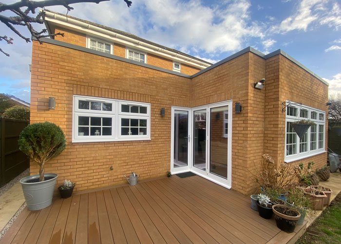 A brick home with an extension into the garden.